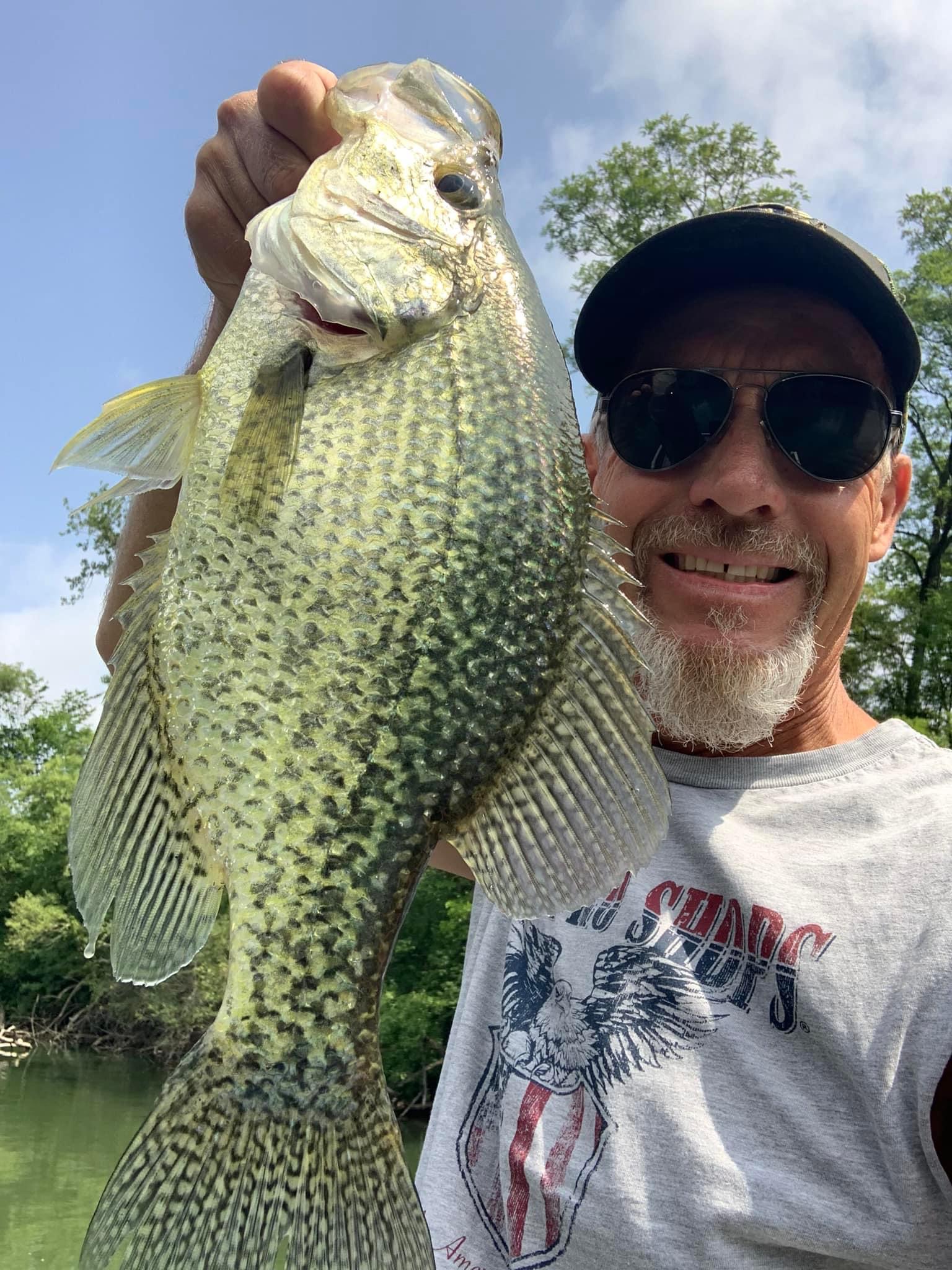 Club member holding a trophy crappie catch on Deer Creek Lake in Plainfield Illinois