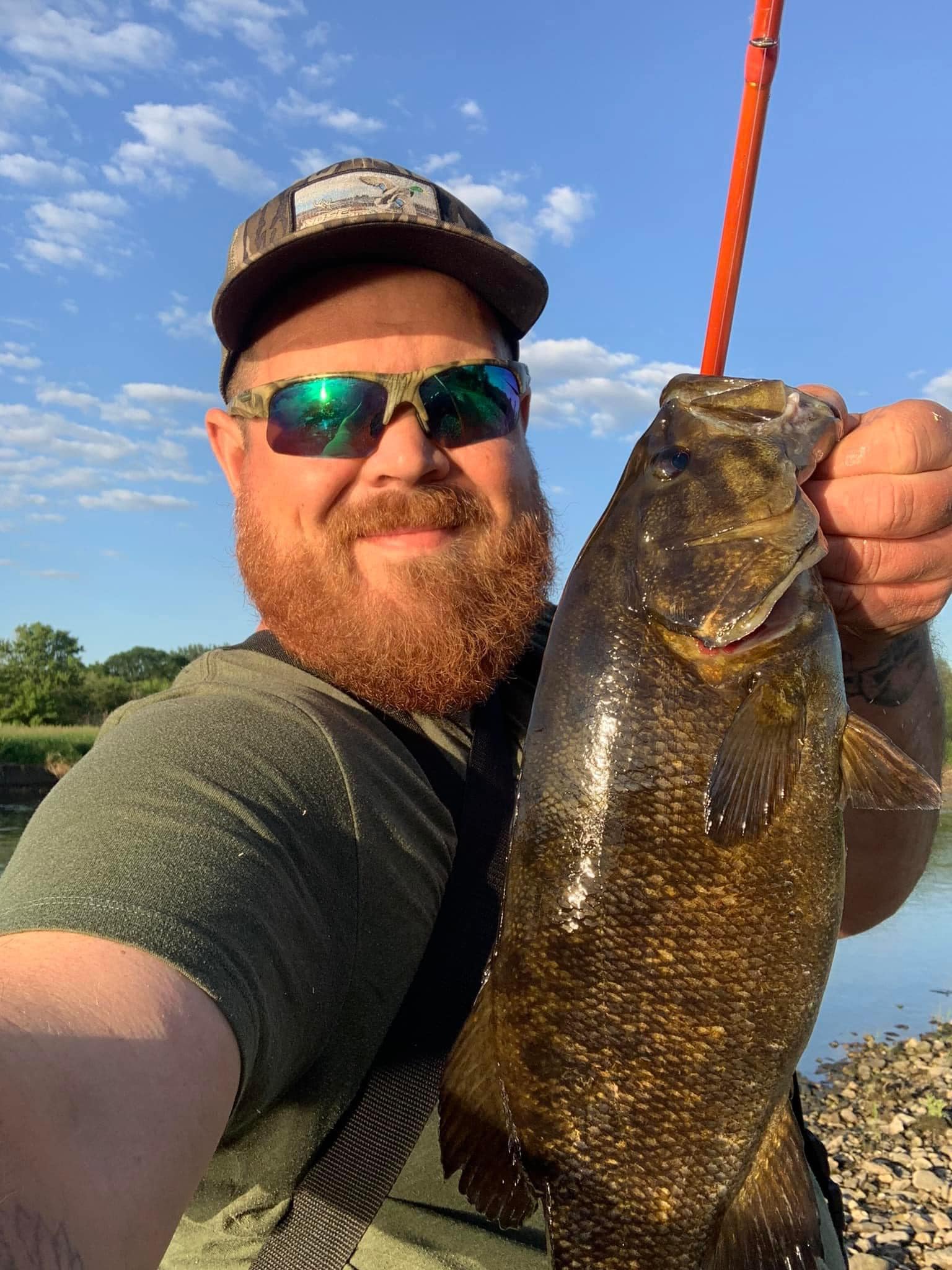 Club member holding a large trophy smallmouth bass caught on Deer Creek Lake in Plainfield Illinois