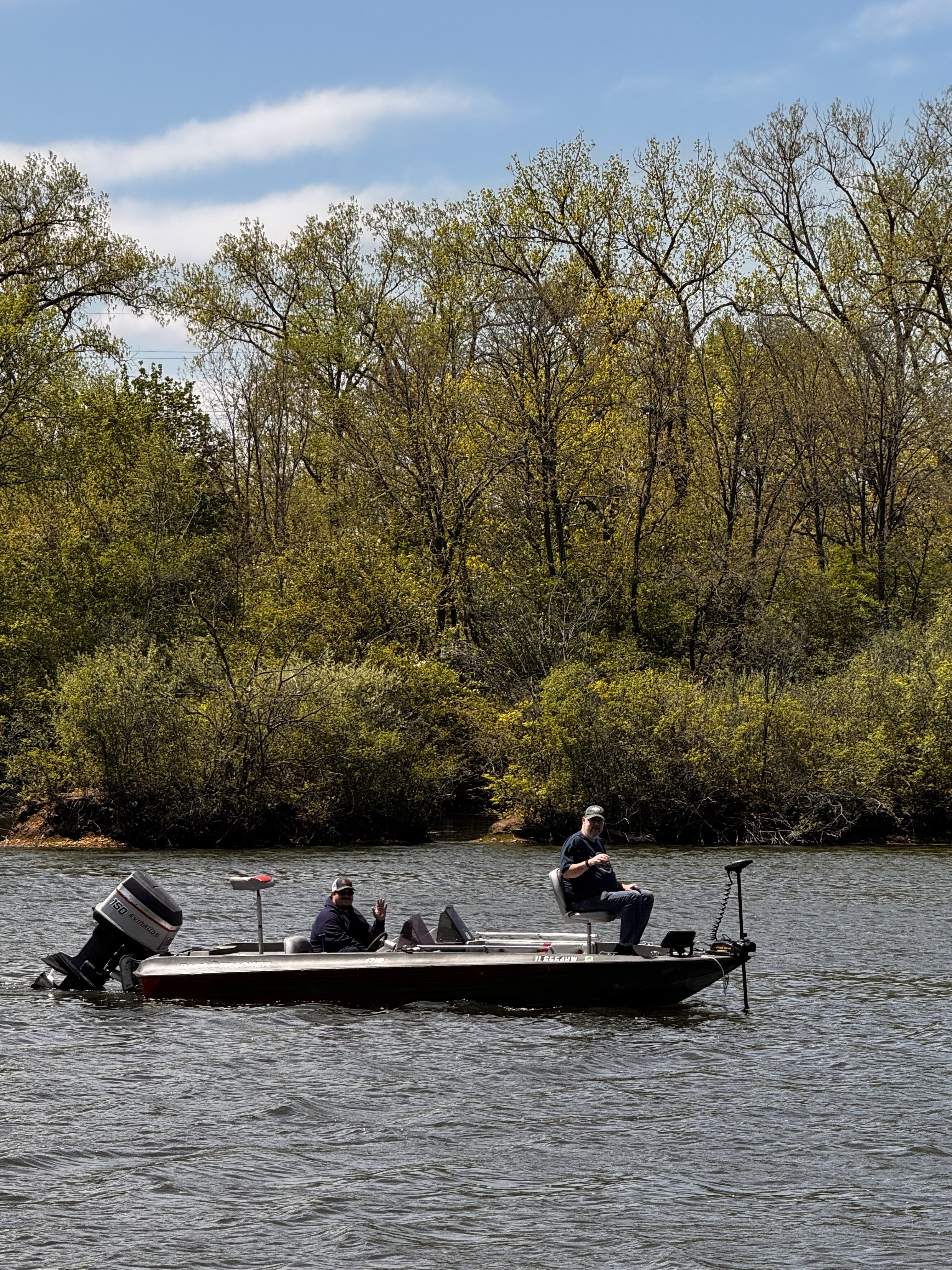 Two Deer Creek members fishing from a bass boat on the lake in Plainfield Illinois