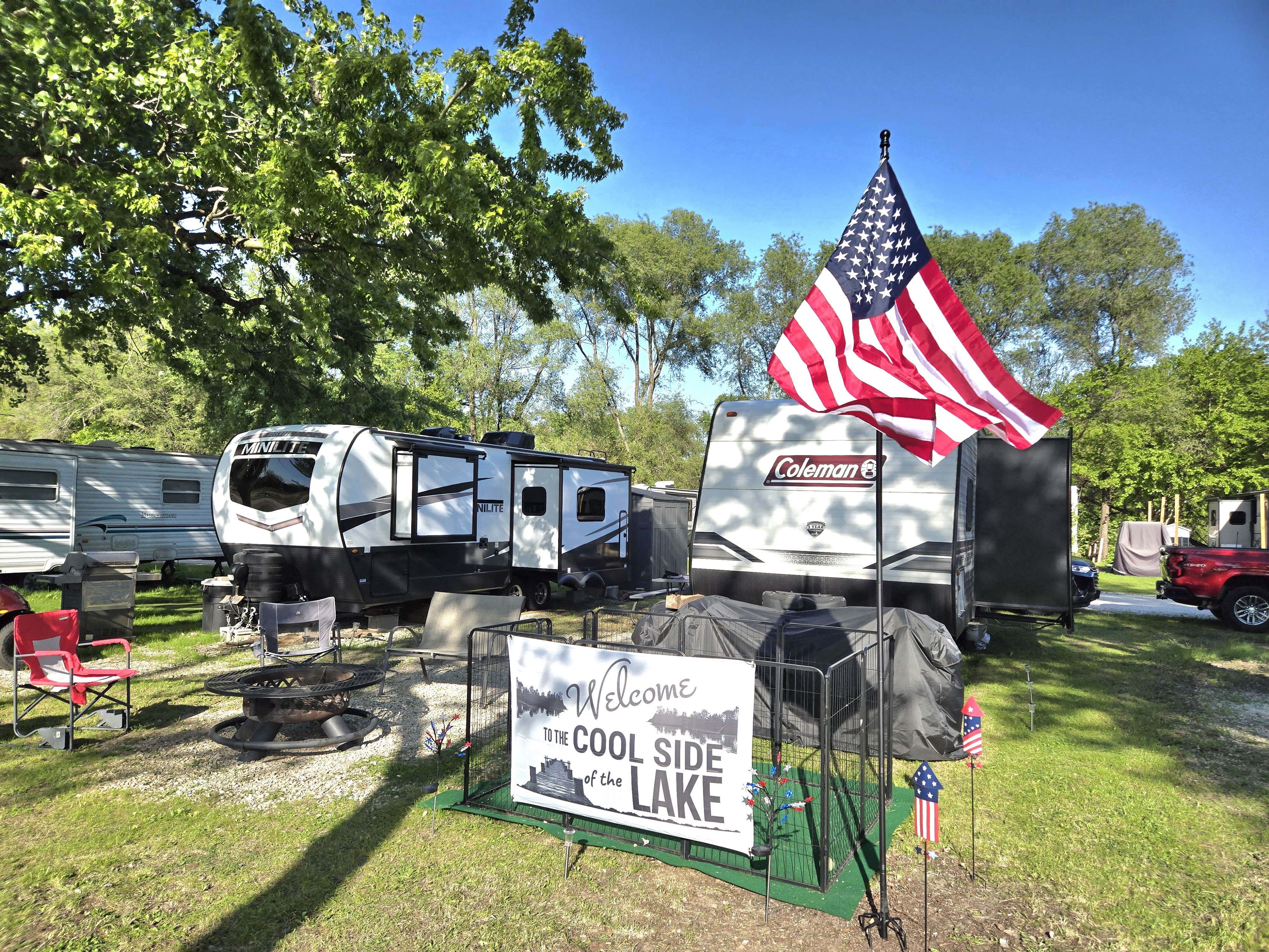 RV campsite decorated with an American flag at Deer Creek Recreation Club in Plainfield Illinois